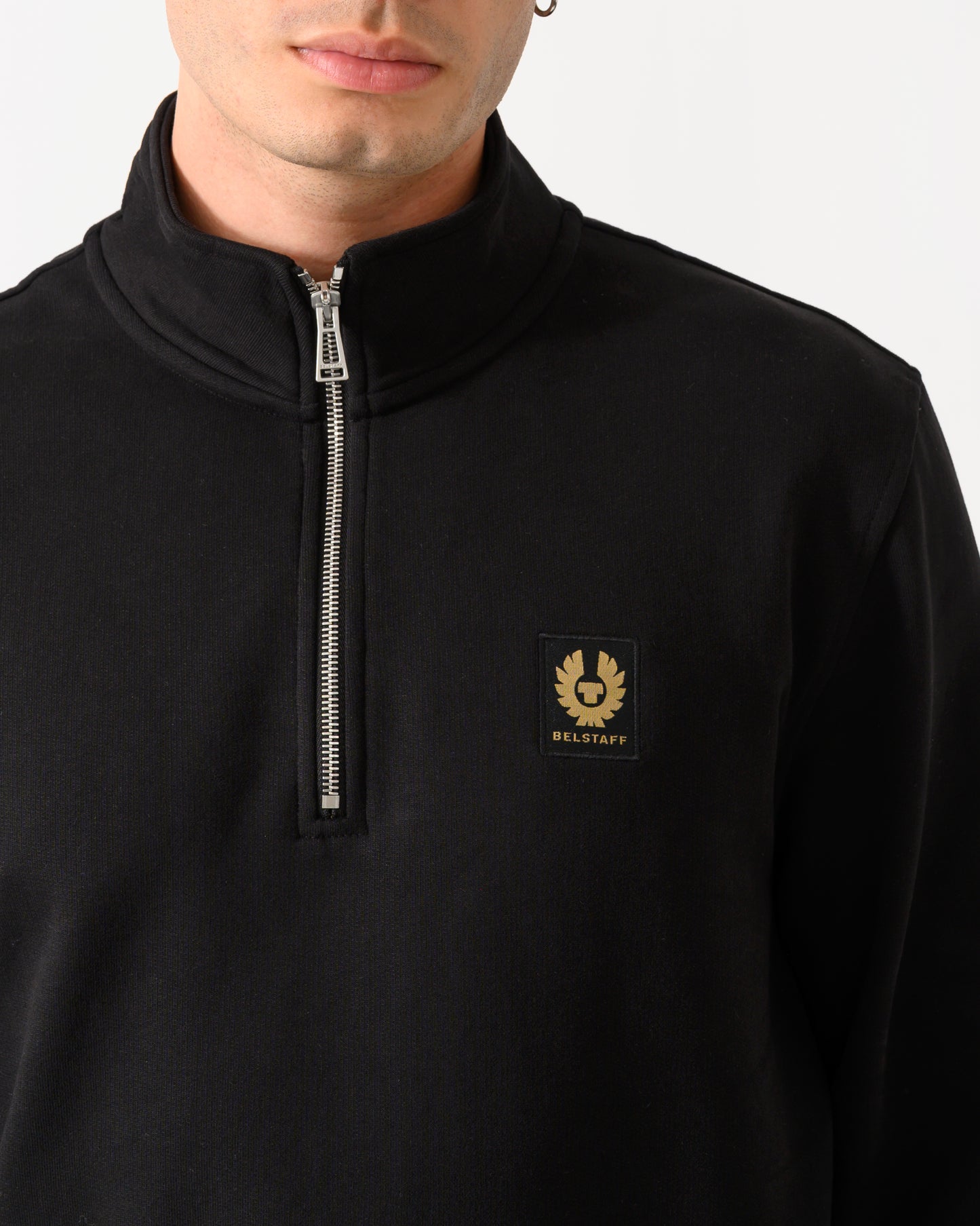 close up shot of a model wearing a Belstaff Mens Logo Quarter Zip Sweatshirt in Black