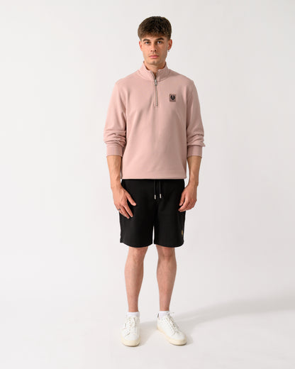 full length shot of a model wearing a Belstaff Mens Logo Quarter Zip Sweatshirt in Dusk Pink