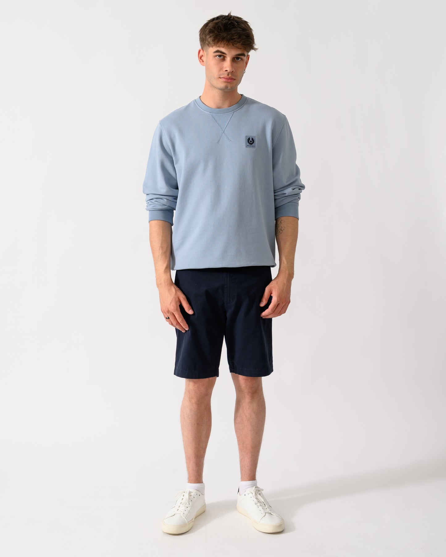 full length shot of a model wearing a Belstaff Mens Logo Sweatshirt in Mist Blue