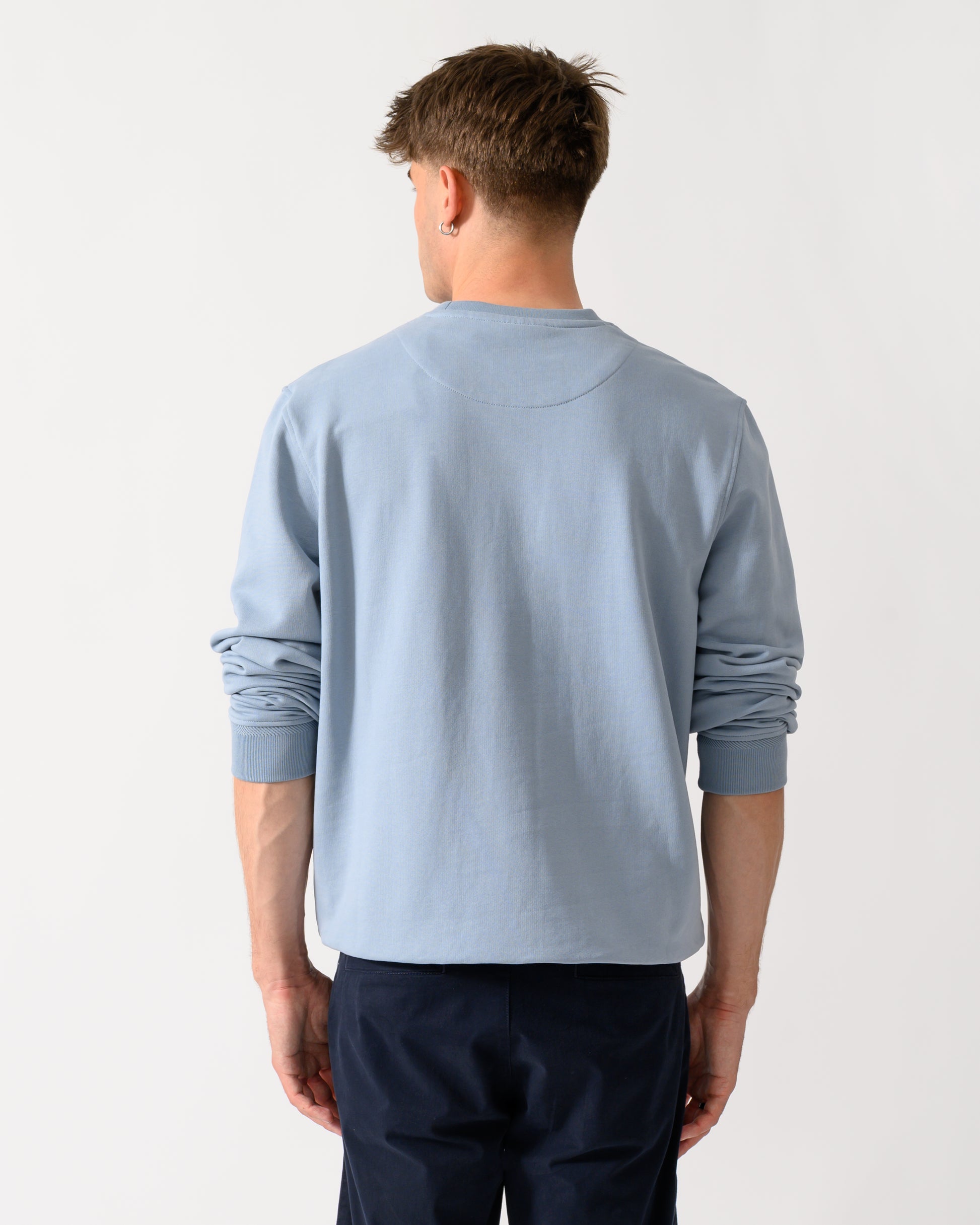 back shot of a model wearing a Belstaff Mens Logo Sweatshirt in Mist Blue