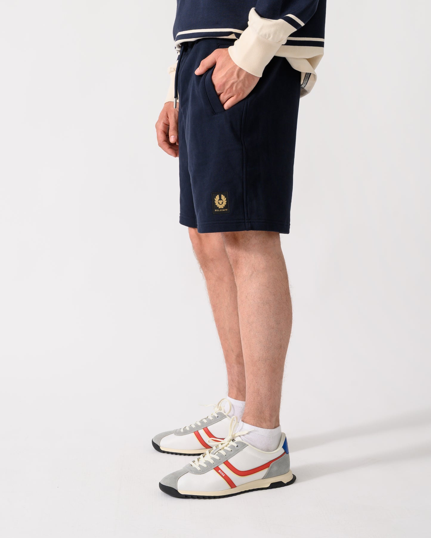 shot of model wearing a pair of Belstaff Mens Logo Sweatshorts in Dark Ink