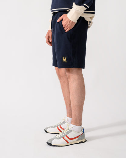 shot of model wearing a pair of Belstaff Mens Logo Sweatshorts in Dark Ink