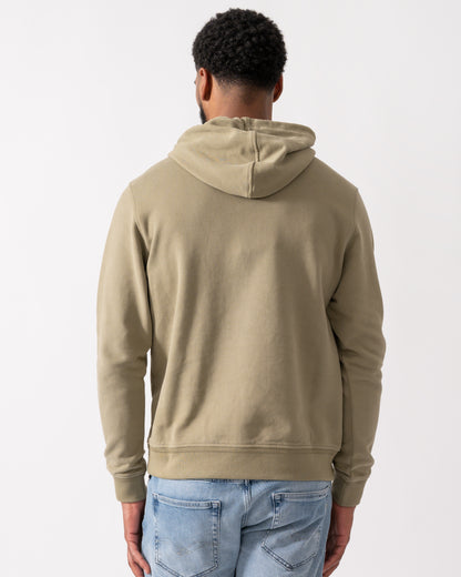back shot of a Model wearing a Belstaff Mens Pullover Logo Patch Hoodie in Fatigue Green