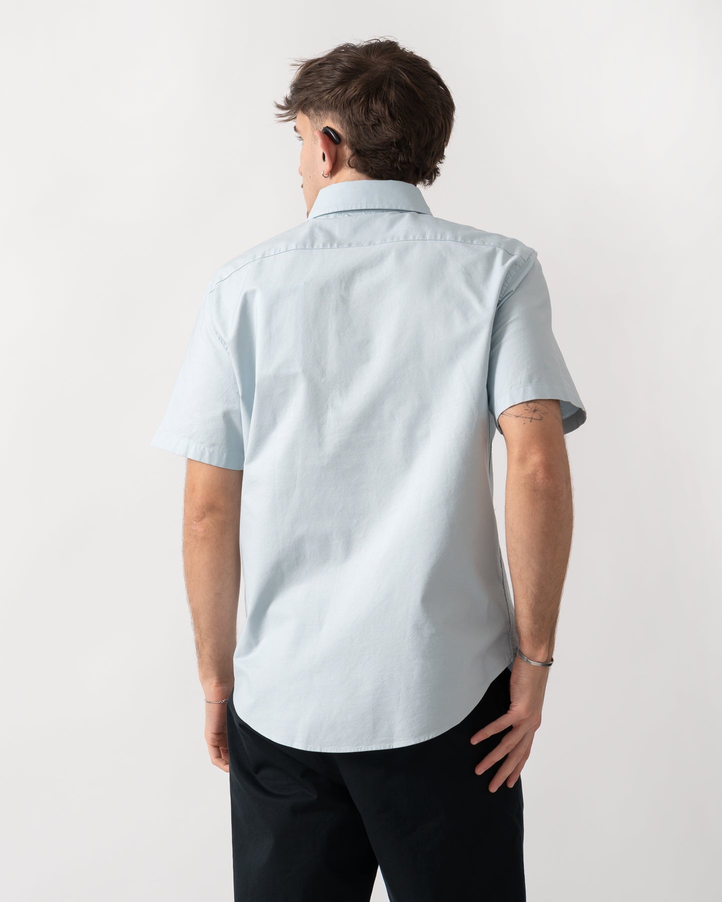back shot of a model wearing a Belstaff Mens Short Sleeve Street Shirt in Sky Blue