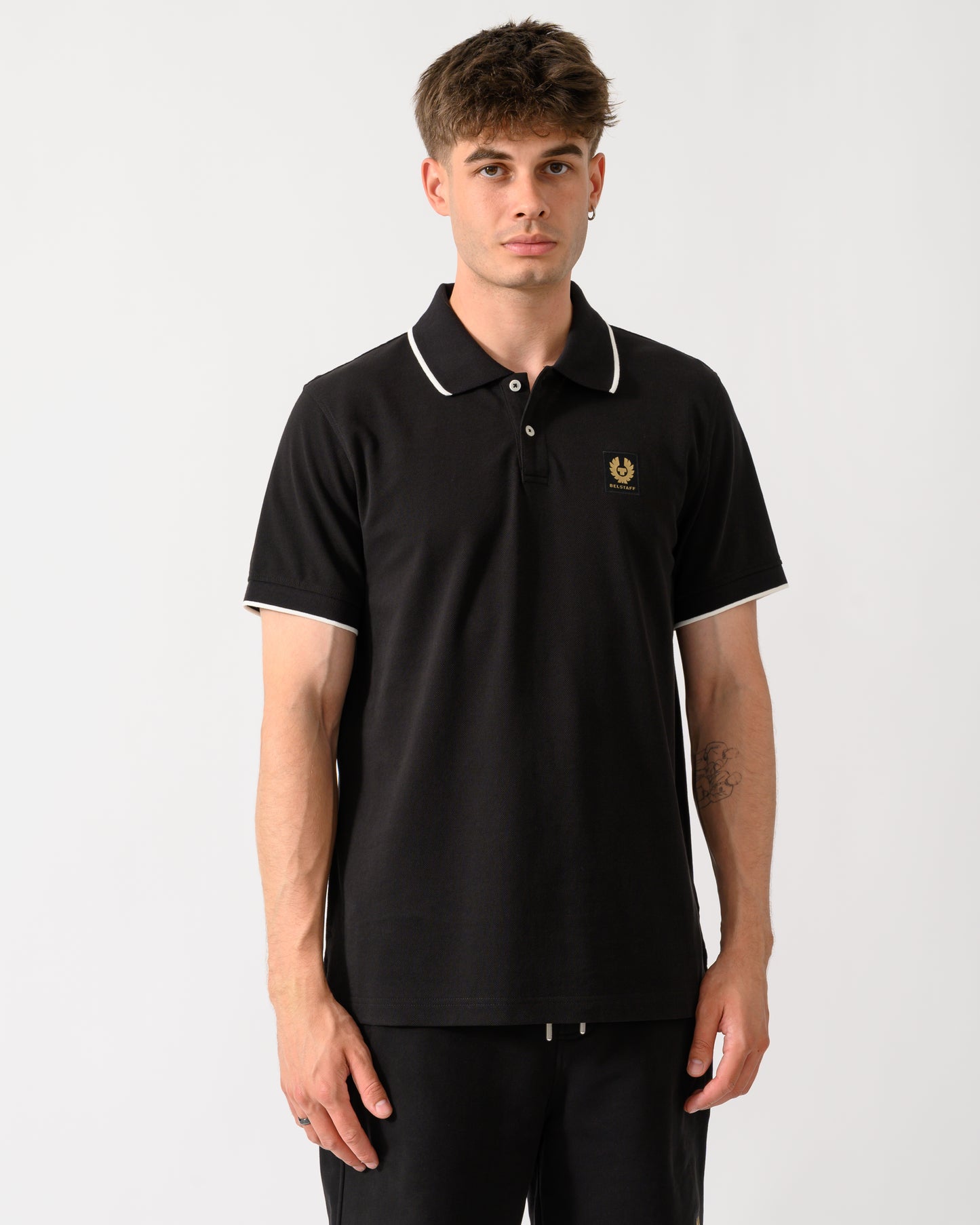 model wearing a Belstaff Mens Tipped Polo Shirt in Black
