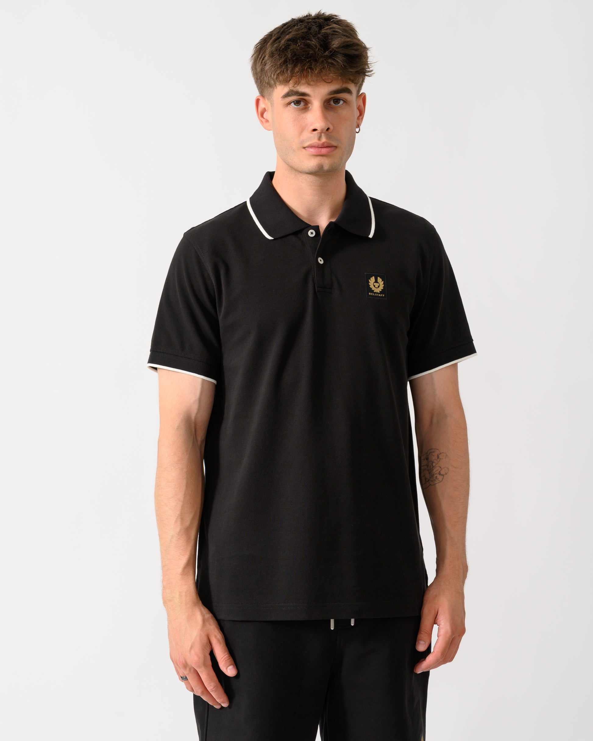 model wearing a Belstaff Mens Tipped Polo Shirt in Black