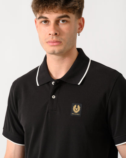 close up shot of a model wearing a Belstaff Mens Tipped Polo Shirt in Black