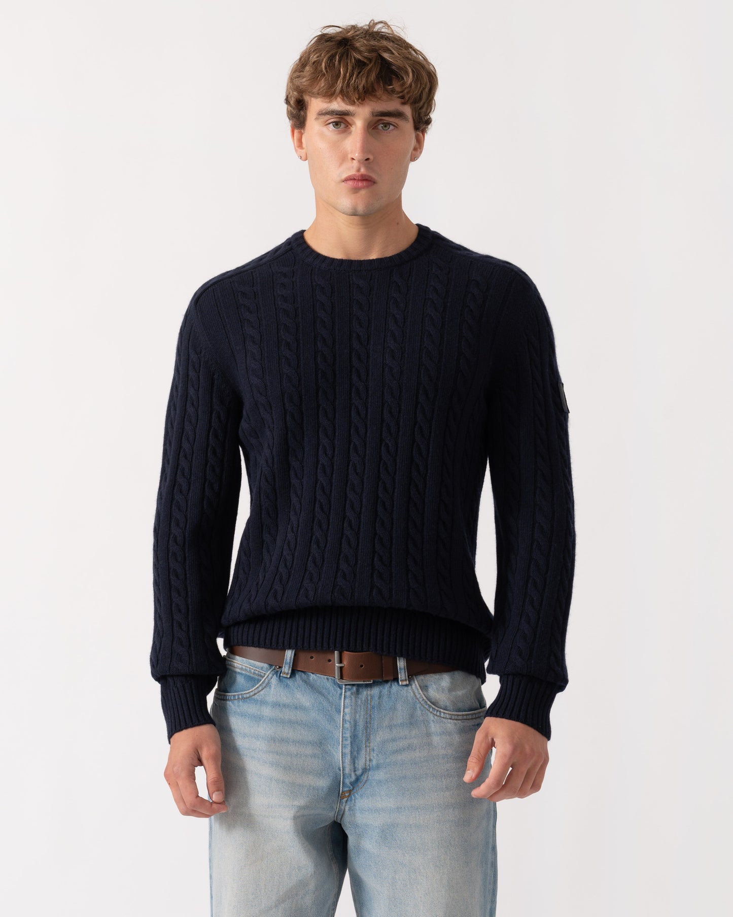 Man wearing Belstaff Mens Westport Crew Neck Cable Knit Jumper - Dark Ink