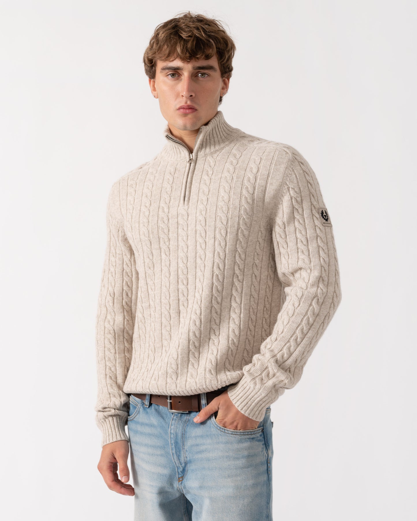 Model wearing Belstaff Mens Westport Quarter Zip Cable Knit Jumper - Pale Stone