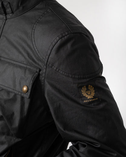 logo detail of a Belstaff Racemaster Mens Waxed Cotton Compact Field Jacket in Black