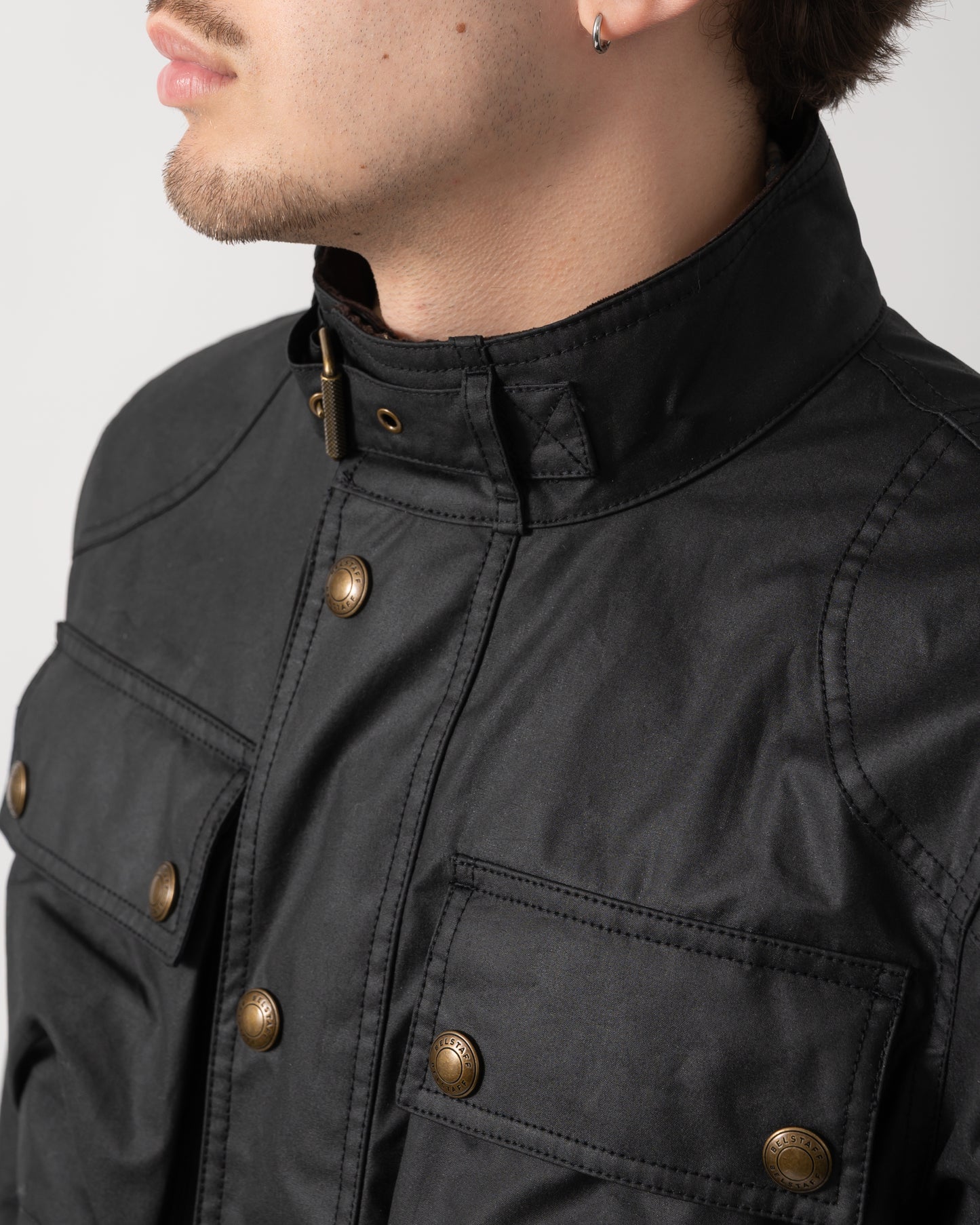 collar and button details of a Belstaff Racemaster Mens Waxed Cotton Compact Field Jacket in Black