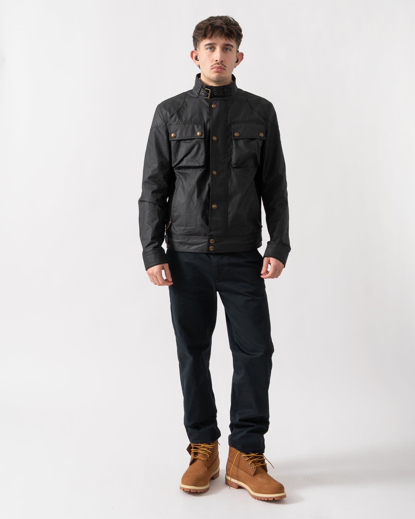full length shot of a model wearing a Belstaff Racemaster Mens Waxed Cotton Compact Field Jacket in Black
