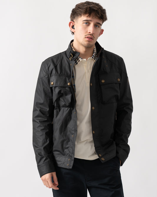 Studio shot of a model wearing a Belstaff Racemaster Mens Waxed Cotton Compact Field Jacket in Black