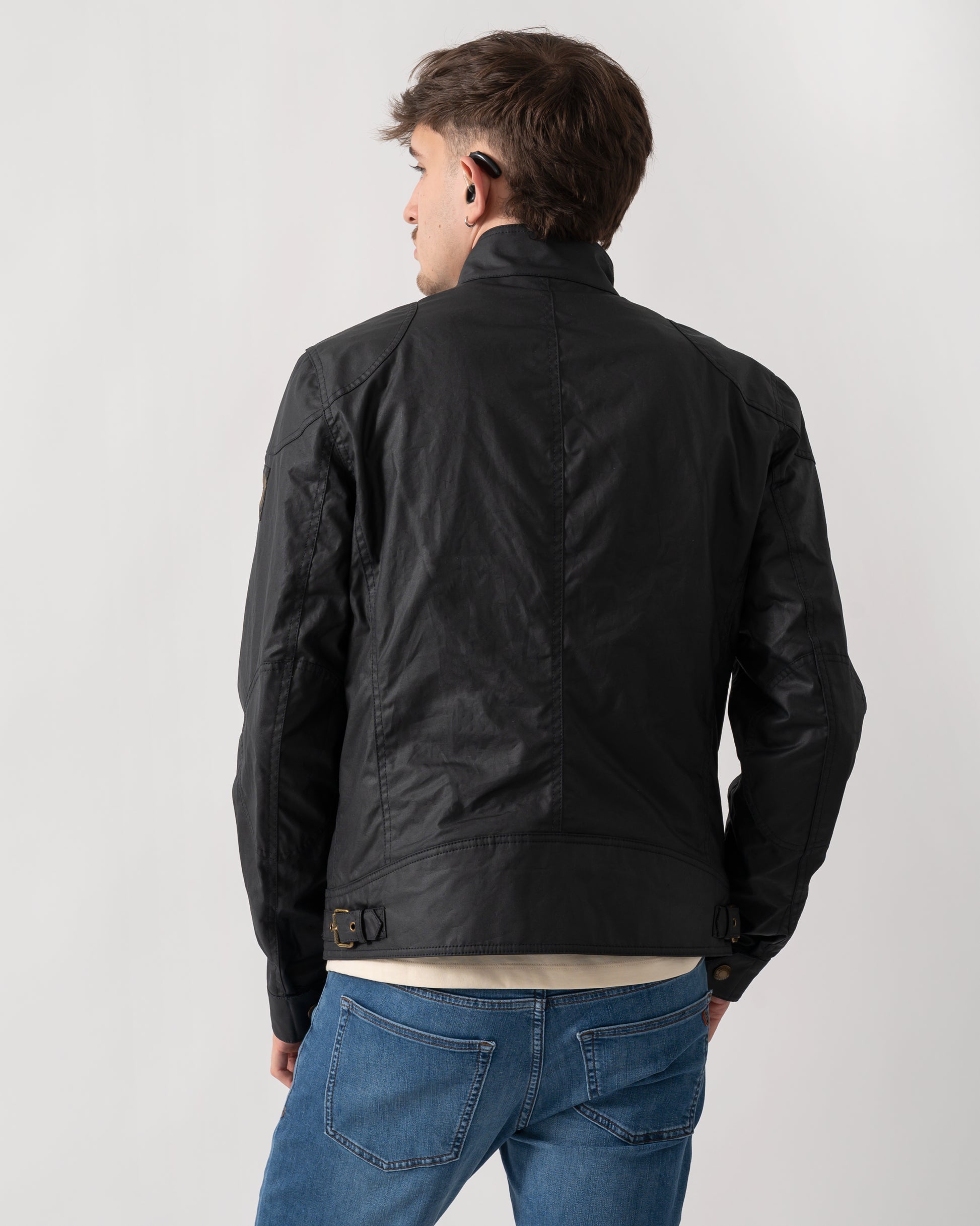 back shot of a model wearing a Belstaff Racemaster Mens Waxed Cotton Compact Field Jacket in Dark Navy