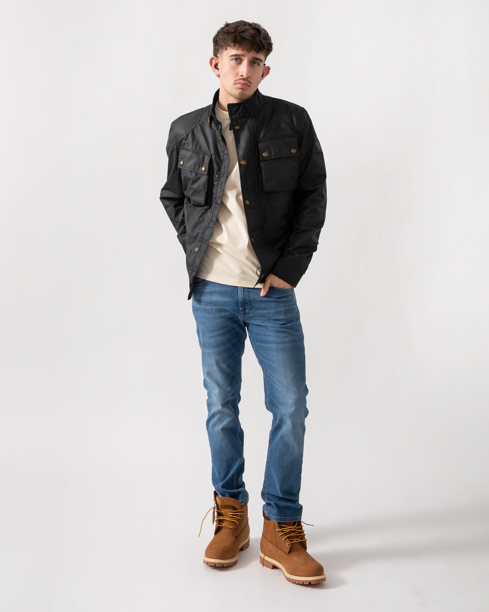full length shot of a model wearing a Belstaff Racemaster Mens Waxed Cotton Compact Field Jacket in Dark Navy