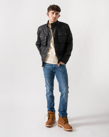 full length shot of a model wearing a Belstaff Racemaster Mens Waxed Cotton Compact Field Jacket in Dark Navy