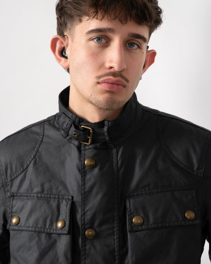 close up shot of a model wearing a Belstaff Racemaster Mens Waxed Cotton Compact Field Jacket in Dark Navy