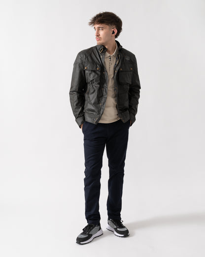 full length shot of a model wearing a Belstaff Racemaster Mens Waxed Cotton Compact Field Jacket in Faded Olive