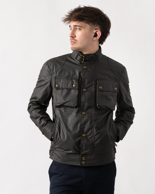 Studio shot of a model wearing a Belstaff Racemaster Mens Waxed Cotton Compact Field Jacket in Faded Olive