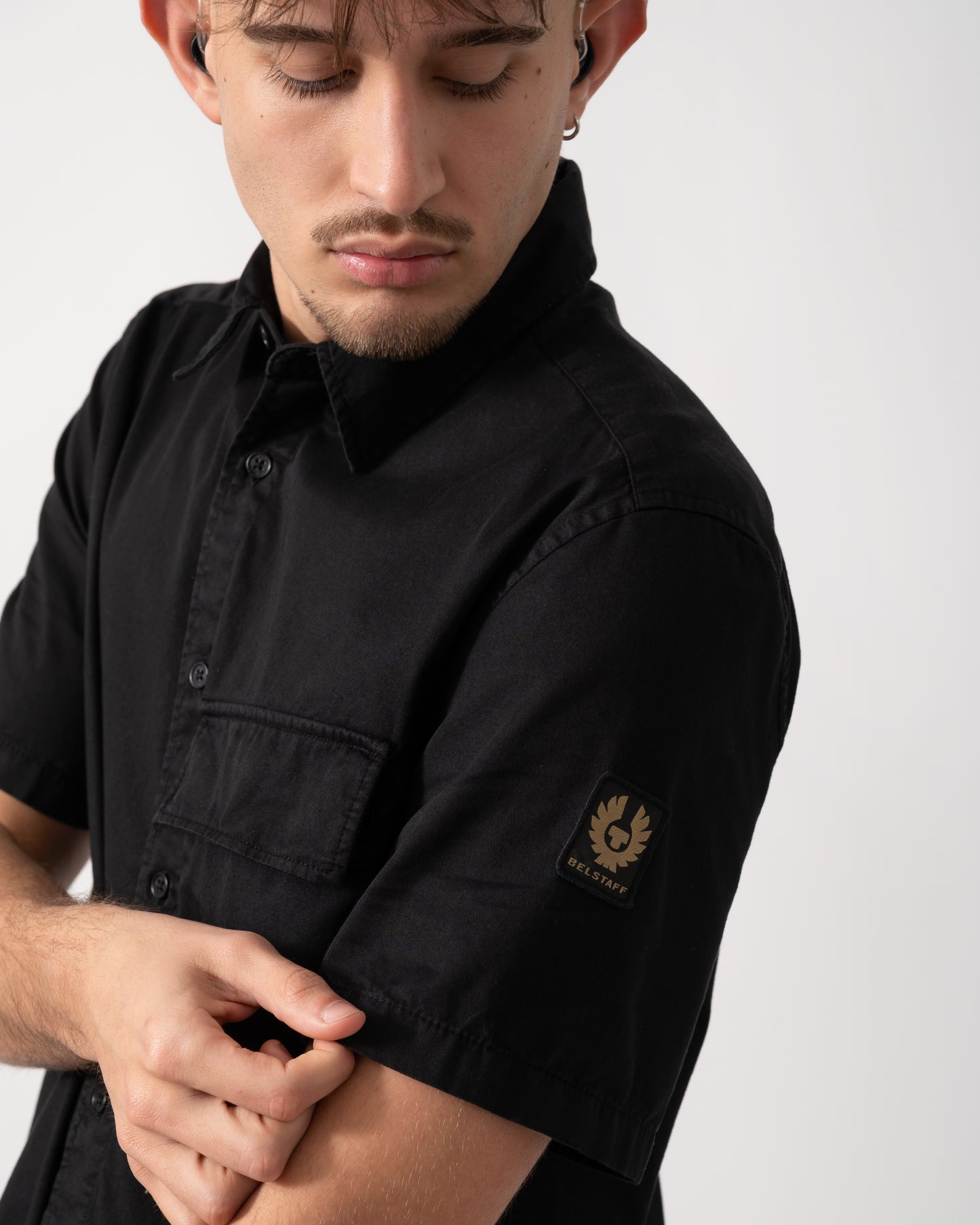 Close up shot of a Model wearing a Belstaff Scale Mens Short Sleeve Shirt in Black