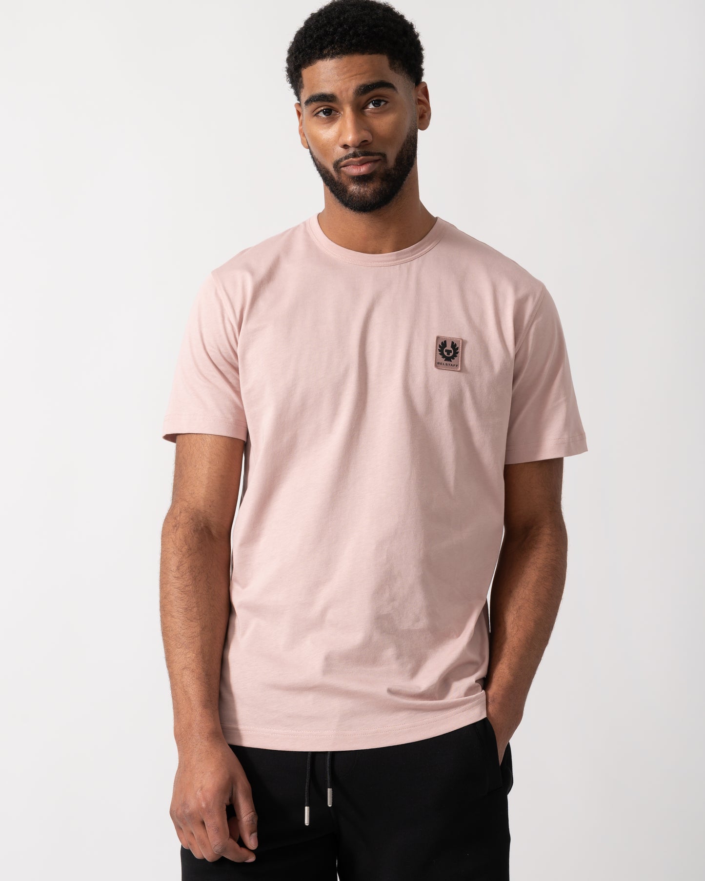 Model wearing a Belstaff Short Sleeved Mens Logo Patch T-Shirt  in Dusk Pink