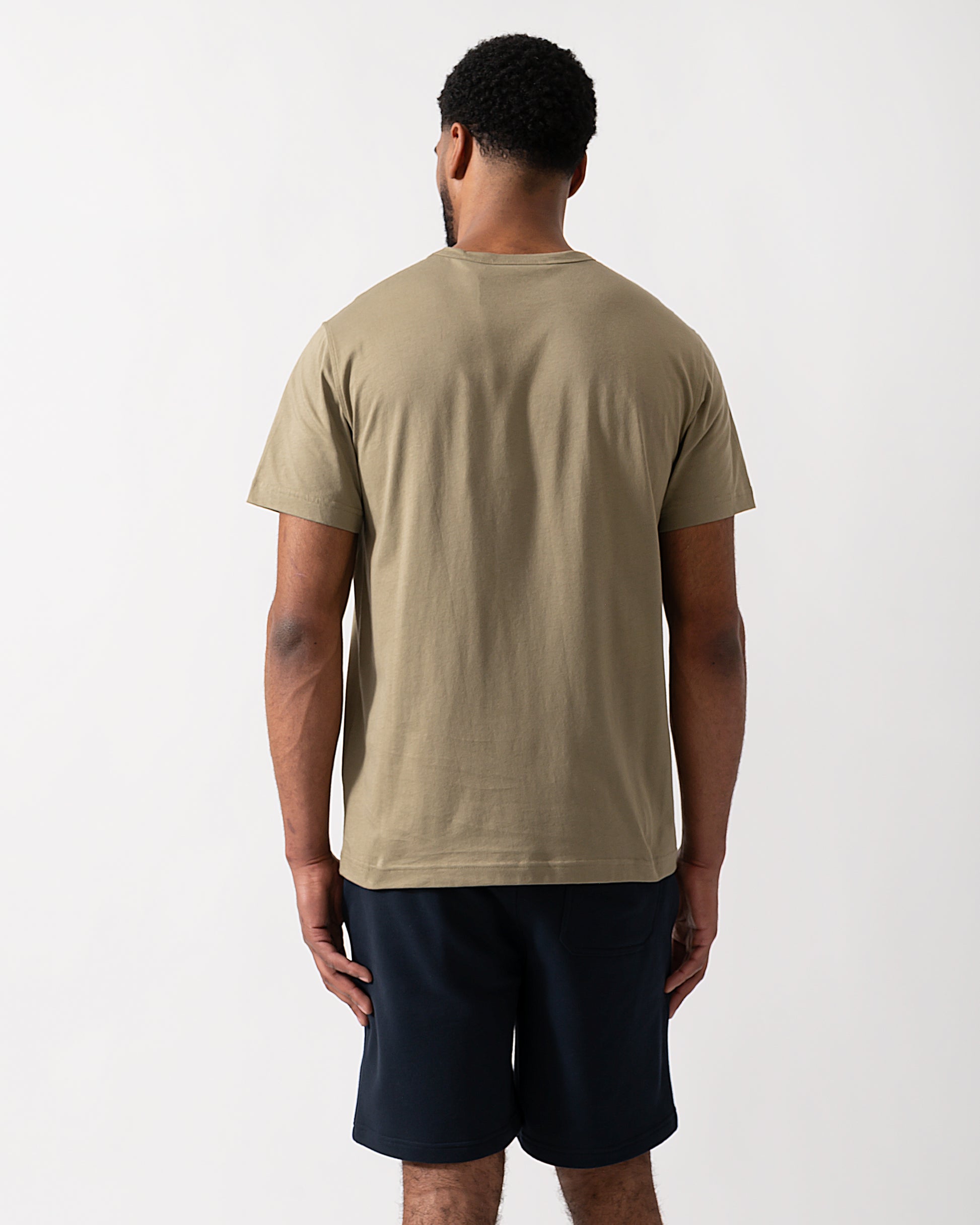 Back shot of a Model wearing a Belstaff Short Sleeved Mens Logo Patch T-Shirt in Fatigue Green