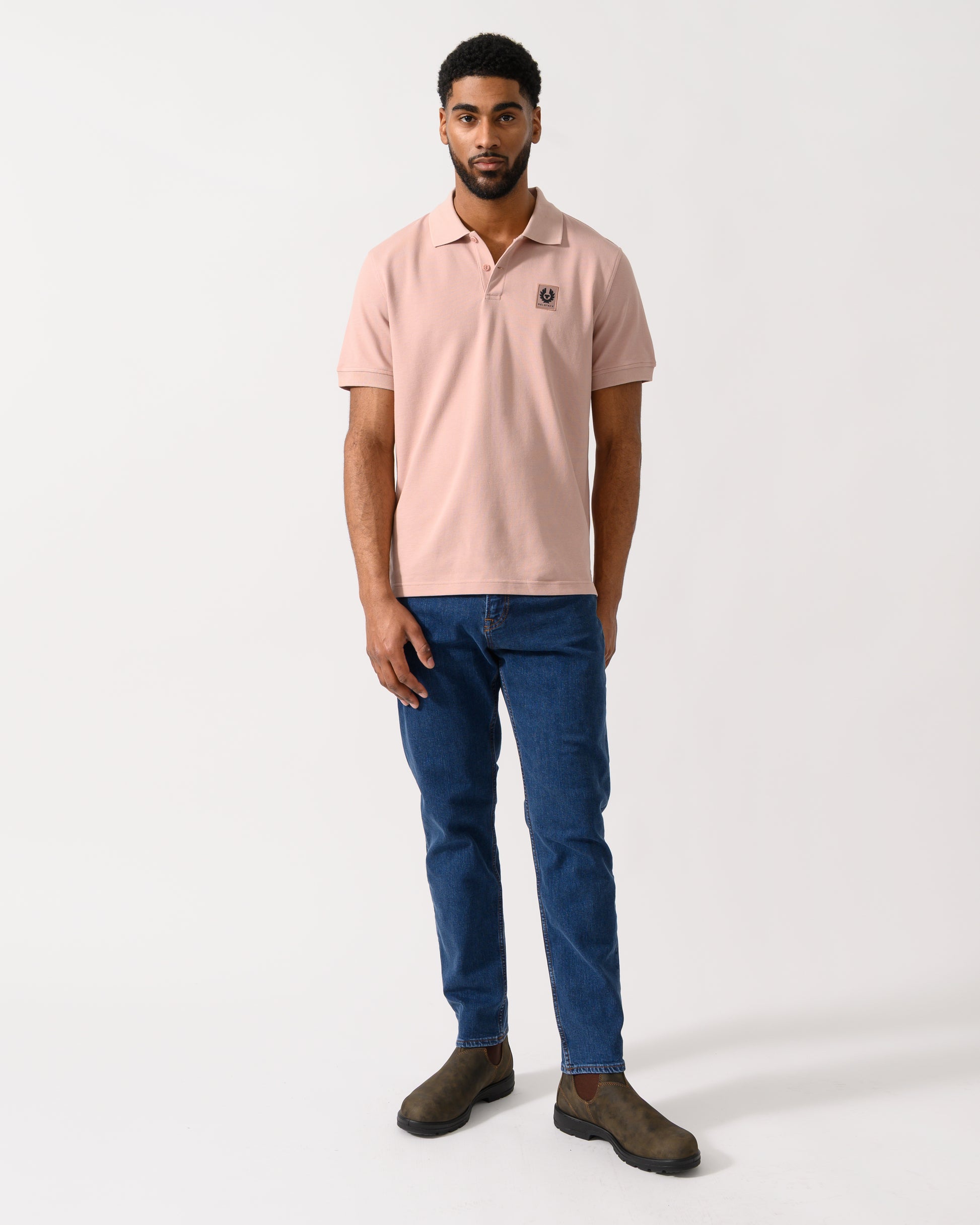 Full length shot of a Model wearing a Belstaff Short Sleeved Mens Polo in Dusk Pink
