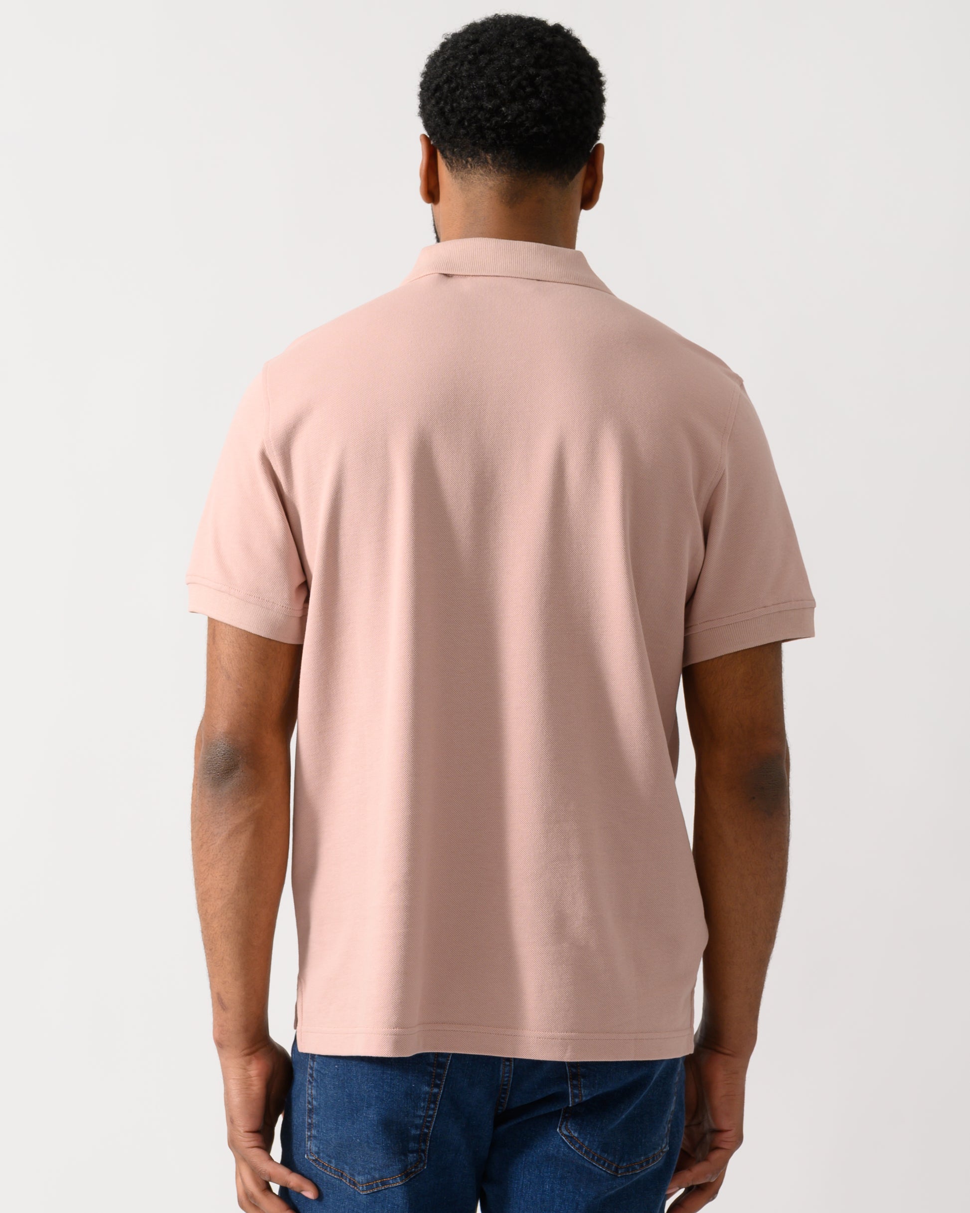 back shot of a Model wearing a Belstaff Short Sleeved Mens Polo in Dusk Pink