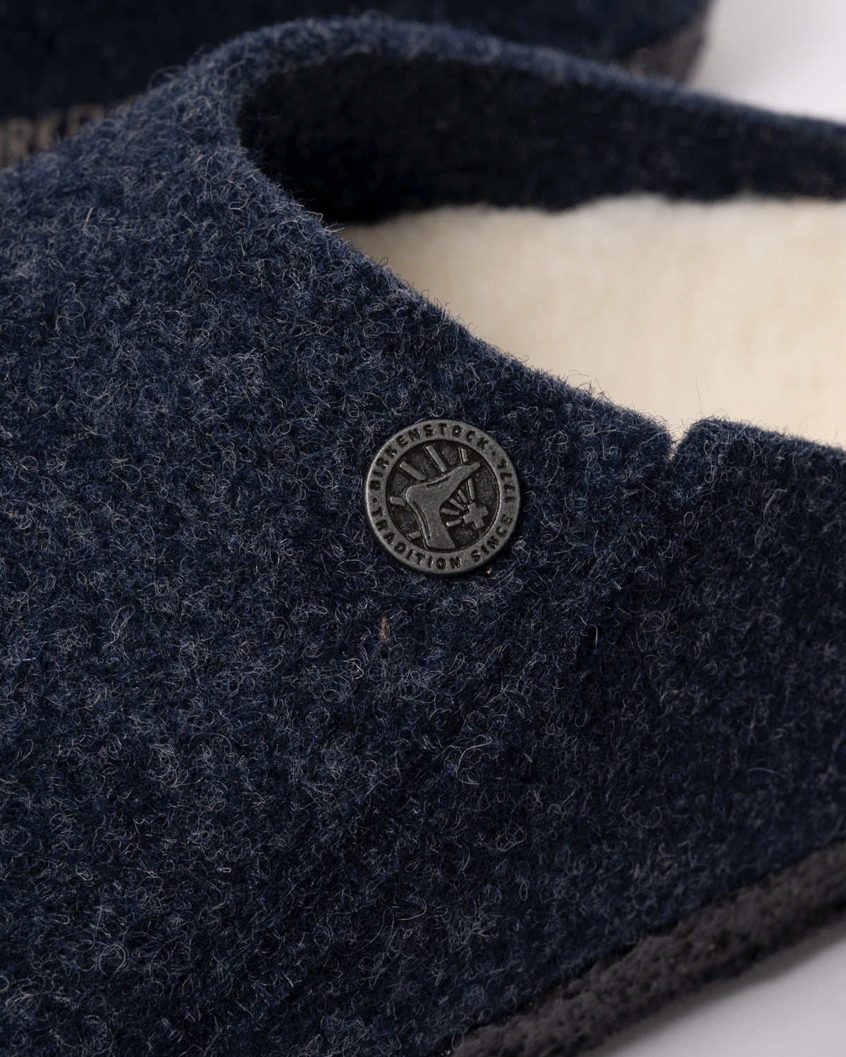 Studio photograph showing a close up of Birkenstock Zermatt Shearling FE Womens Clogs  Dark Bluen