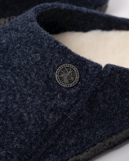 Studio photograph showing a close up of Birkenstock Zermatt Shearling FE Womens Clogs  Dark Bluen