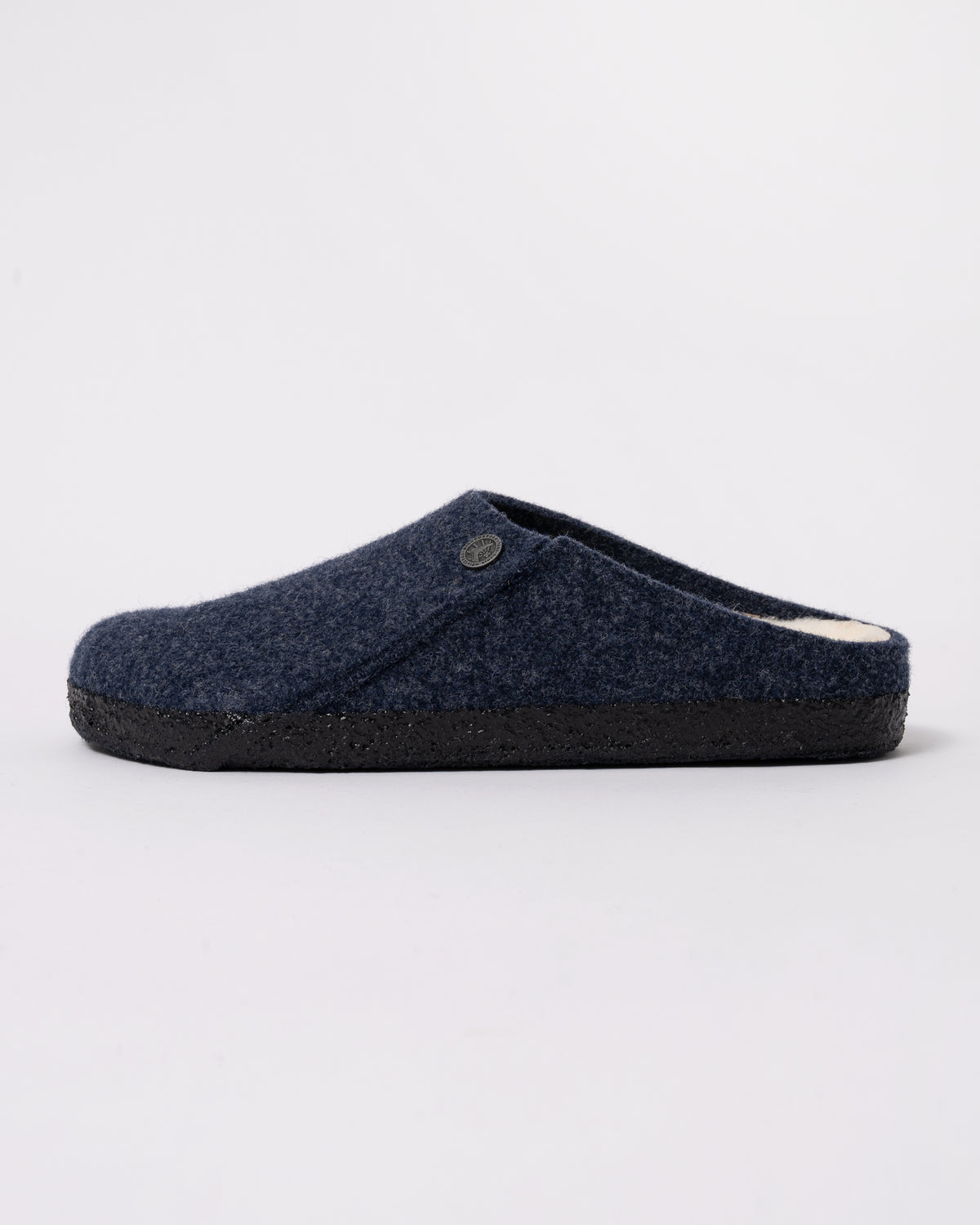 Studio photograph showing side of Birkenstock Zermatt Shearling FE Womens Clogs  Dark Bluen