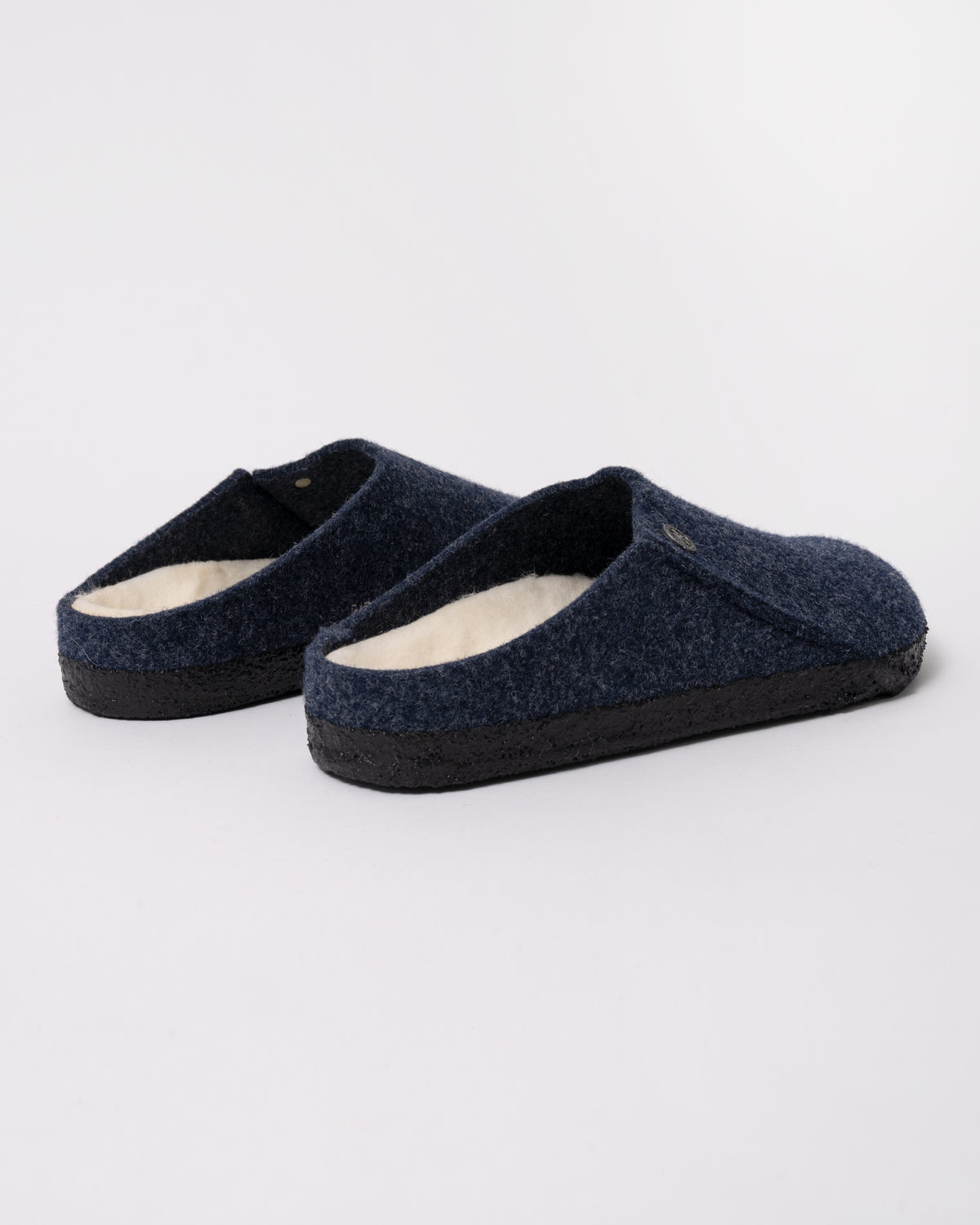 Studio photograph showing the back of Birkenstock Zermatt Shearling FE Womens Clogs  Dark Bluen