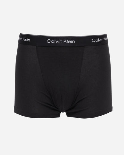 studio shot of Calvin Klein 3 Pack Icon Cotton Stretch Mens Relaxed Fit Trunks in Black with black silver waistbands