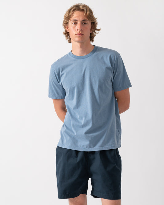 model wearing a Colorful Standard Classic Organic T-Shirt in Faded Indigo