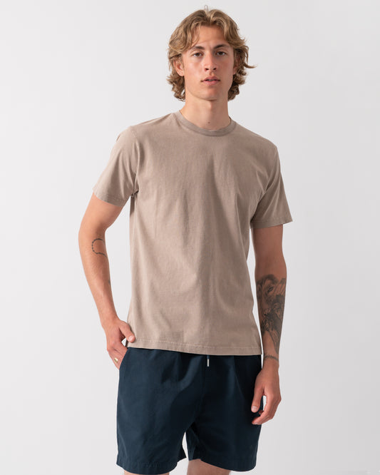 model wearing a Colorful Standard Classic Organic T-Shirt in Faded Khaki