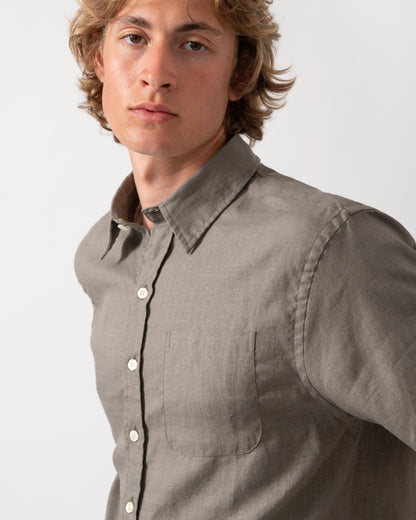 close up shot of a model wearnig a Colorful Standard Mens Short Sleeve Linen Shirt in Dusty Olive
