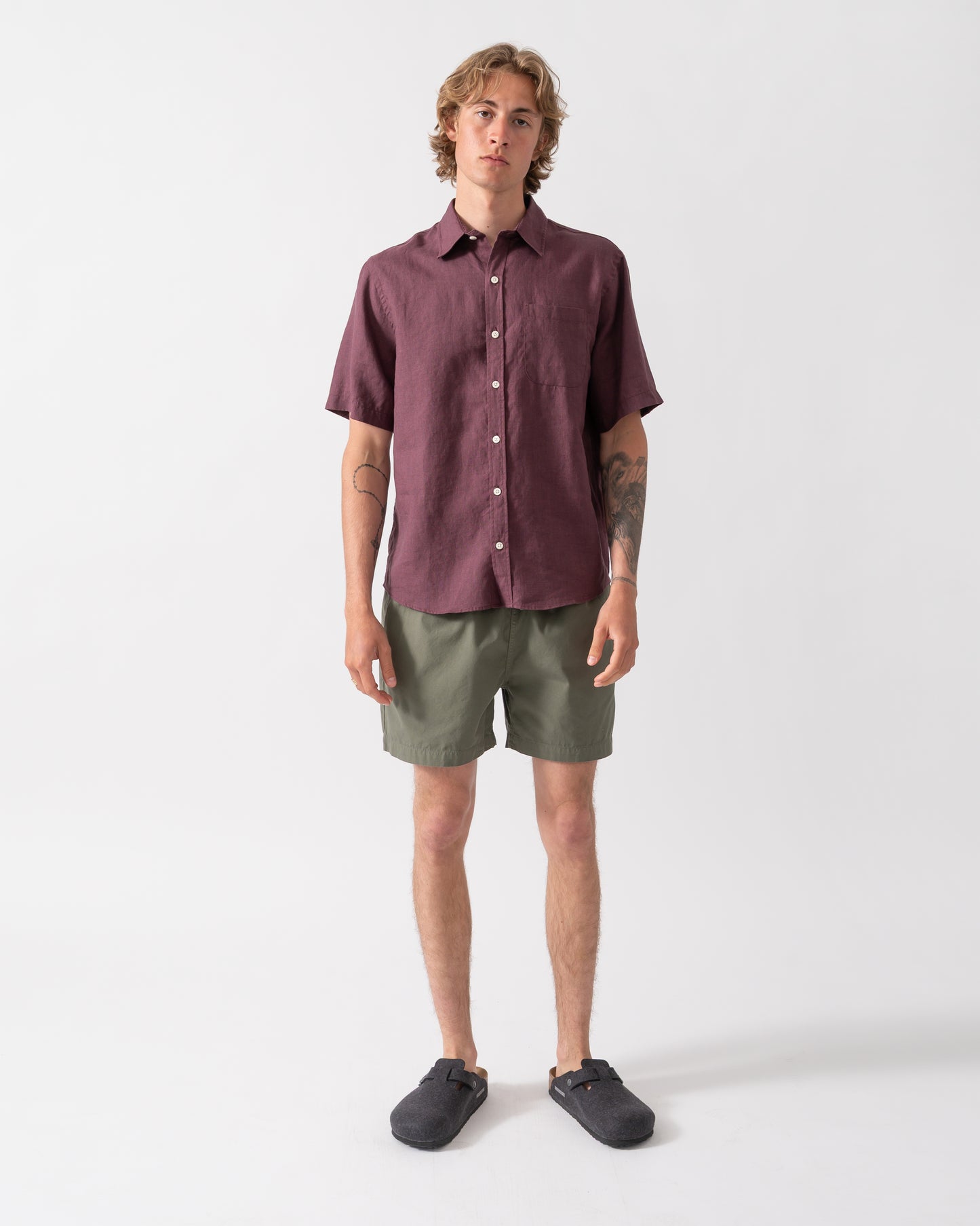 full length shot of model wearing Colorful Standard Organic Twill Shorts in Dusty Olive