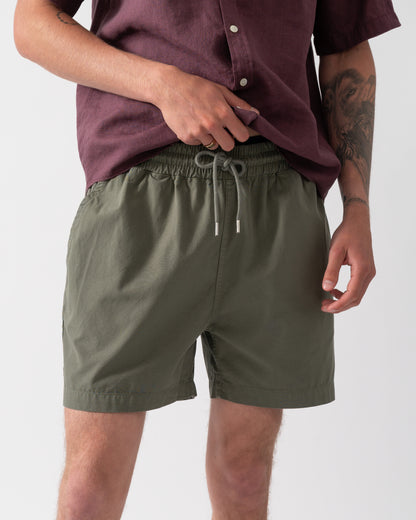 close up shot of model wearing Colorful Standard Organic Twill Shorts in Dusty Olive