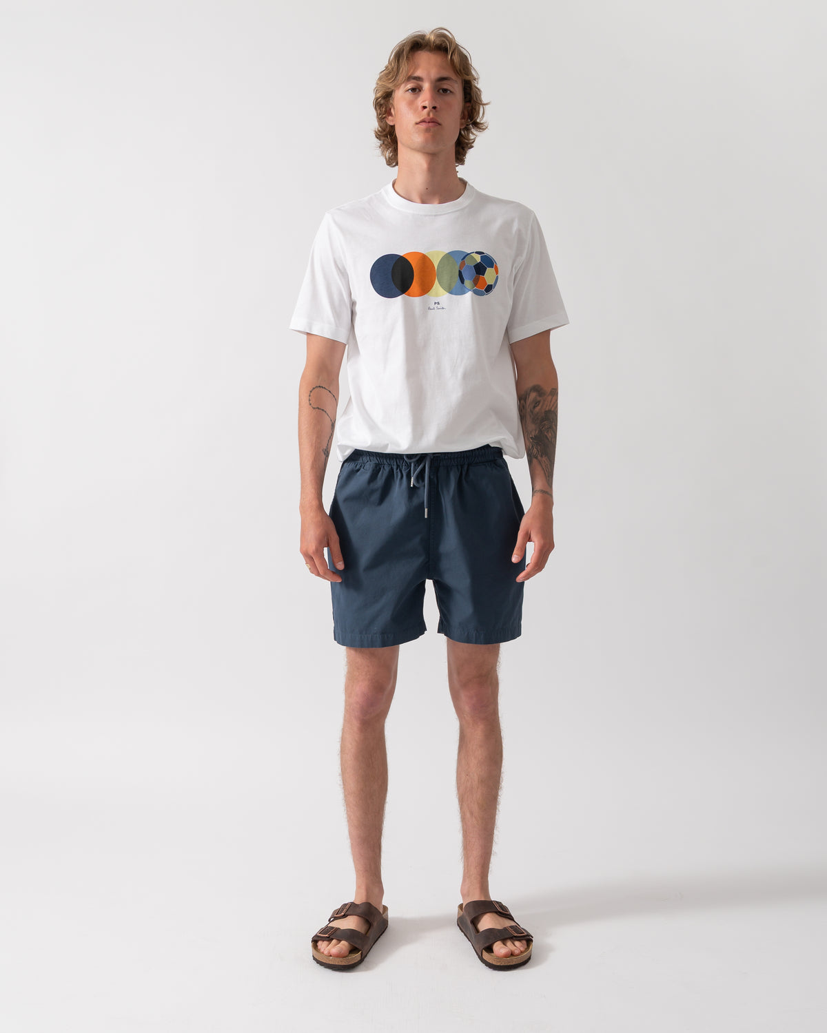 full length shot of model wearing Colorful Standard Organic Twill Shorts in Petrol Blue