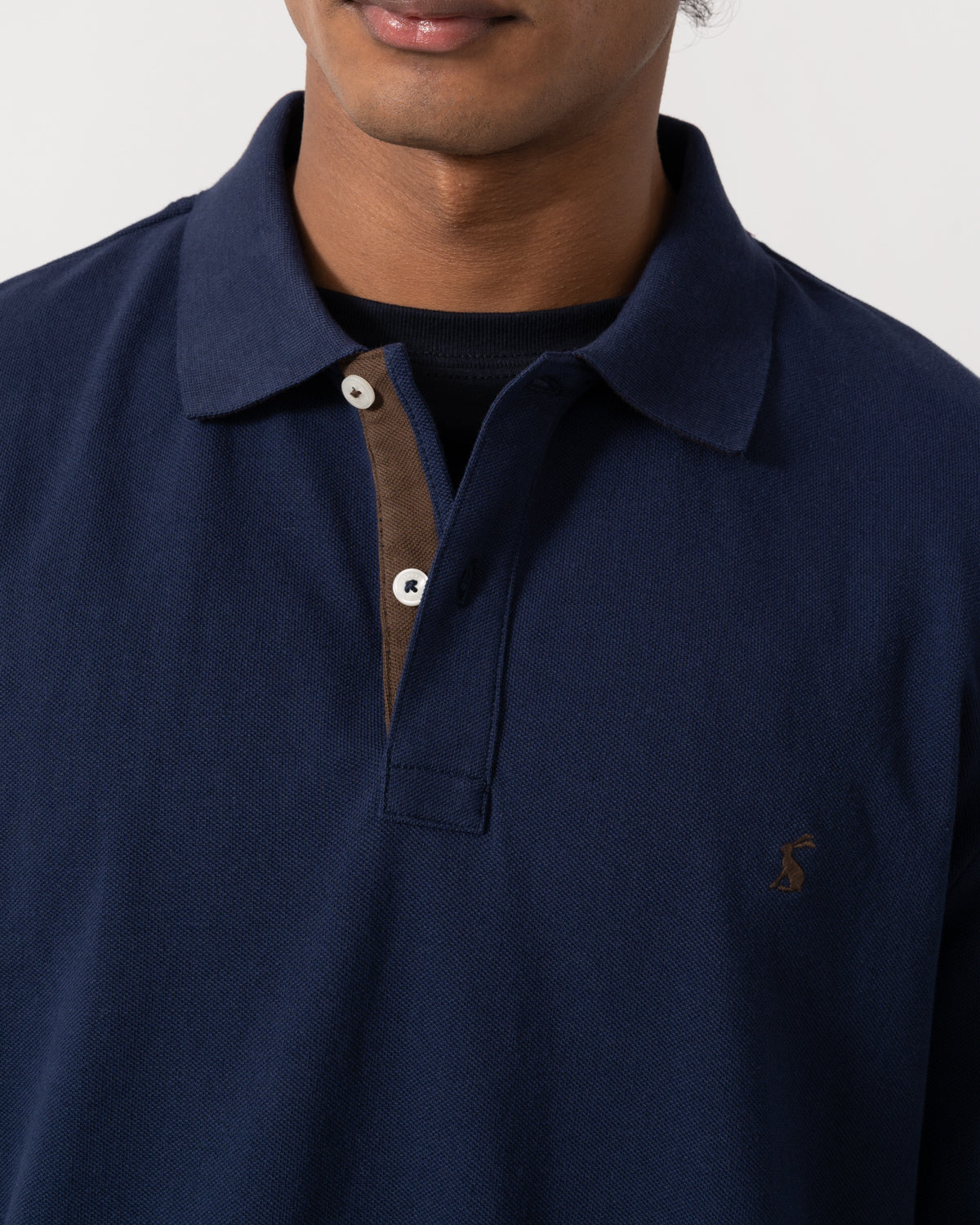 Close up of the Joules Woody Mens Long Sleeve Polo Shirt - Navy