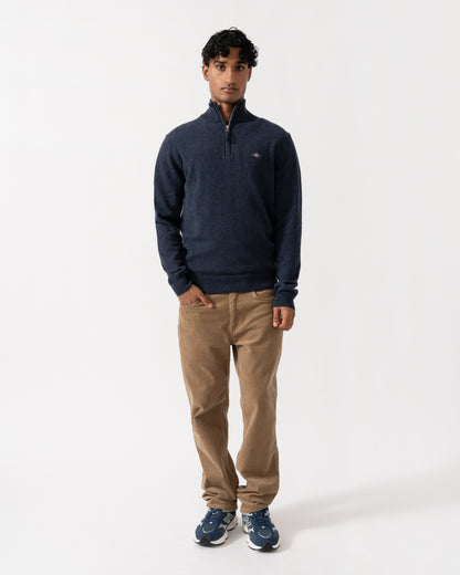 Man wearing the GANT Mens Superfine Lambswool Half Zip Sweater - 480 Dark Navy Melange