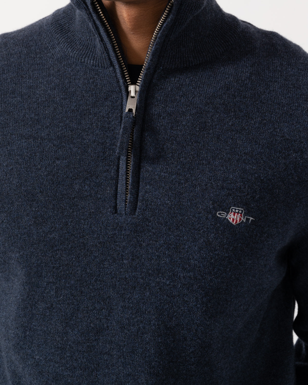 Close up on the GANT Mens Superfine Lambswool Half Zip Sweater - 480 Dark Navy Melange
