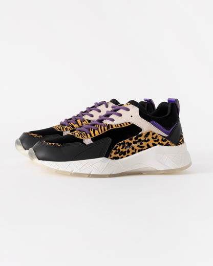 Sneakers with leopard print and purple accents on a white background