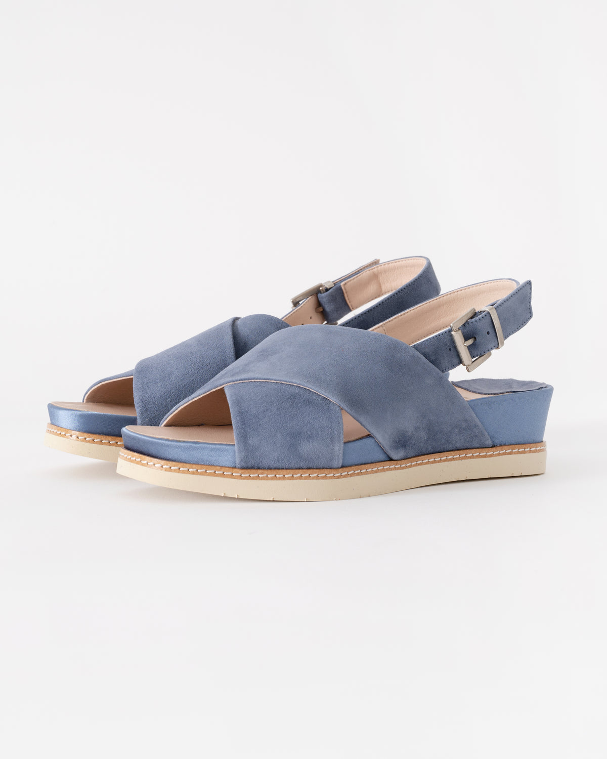 Pair of blue sandals on a white background