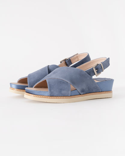 Pair of blue sandals on a white background