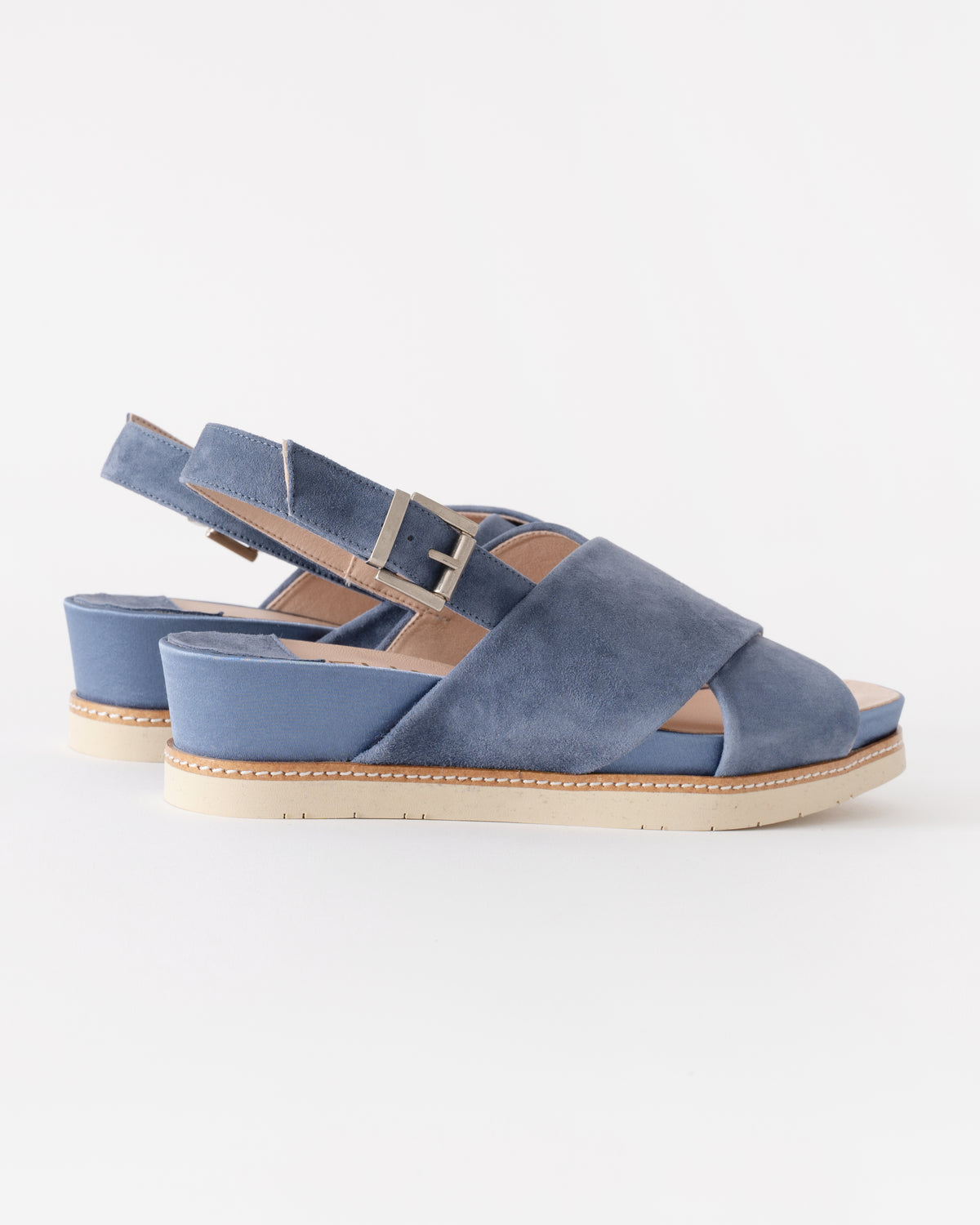 Blue sandals with a white background