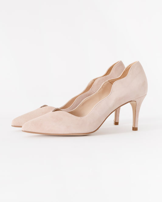 Pair of beige high-heeled shoes on a white background