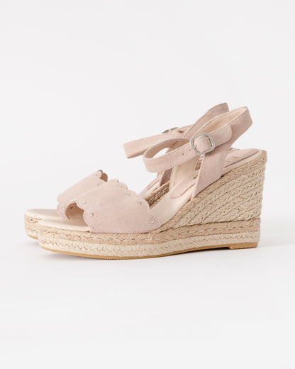 Beige wedge sandal with espadrille sole on a white background