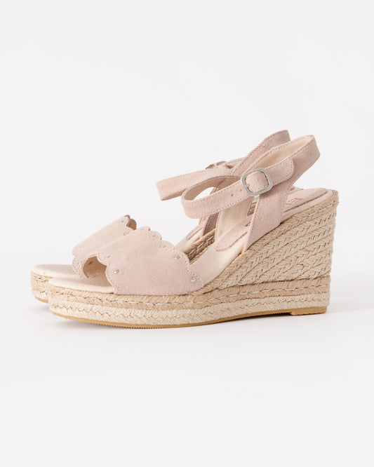 Beige wedge sandal with espadrille sole on a white background
