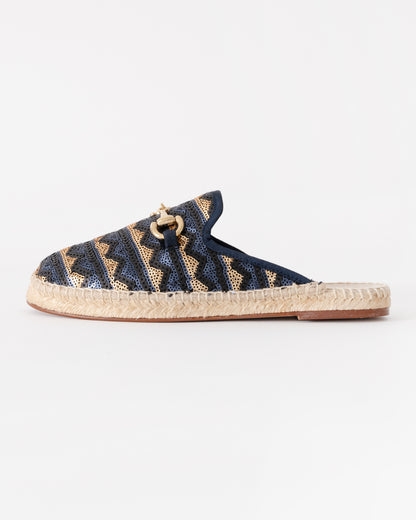 Navy blue espadrille slipper with gold accents on a white background